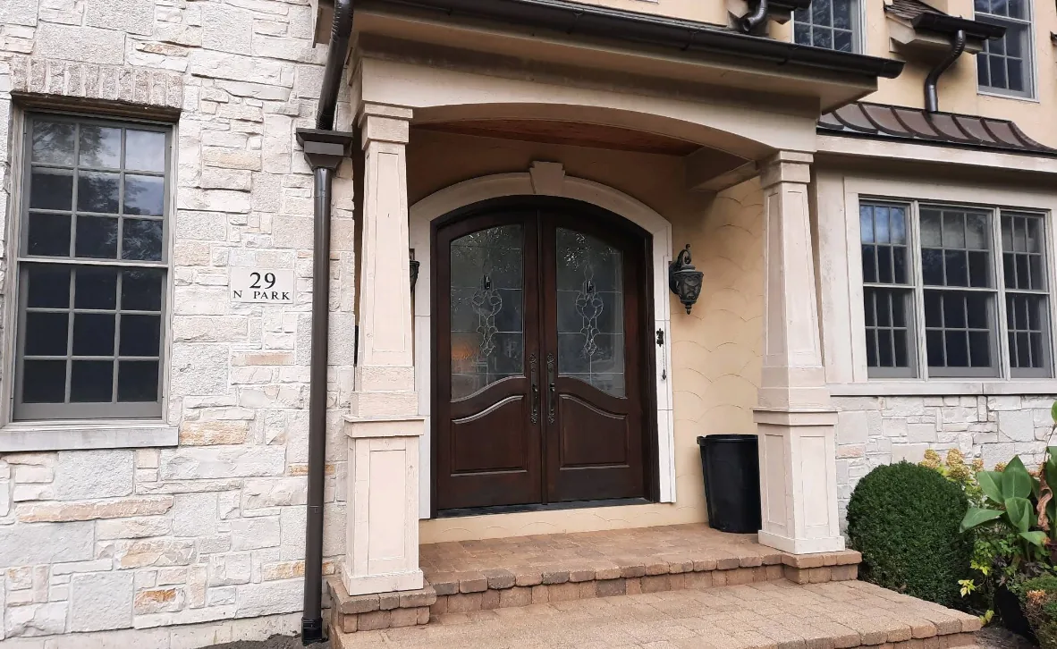 Reviews 21 Stone entryway with copper downspouts