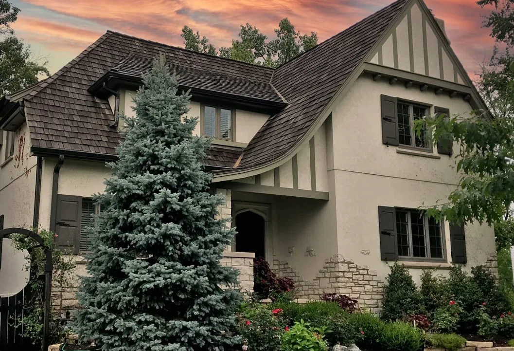 Reviews 24 Tudor style stucco home at sunset